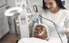 Girl doing facial procedures to beautician